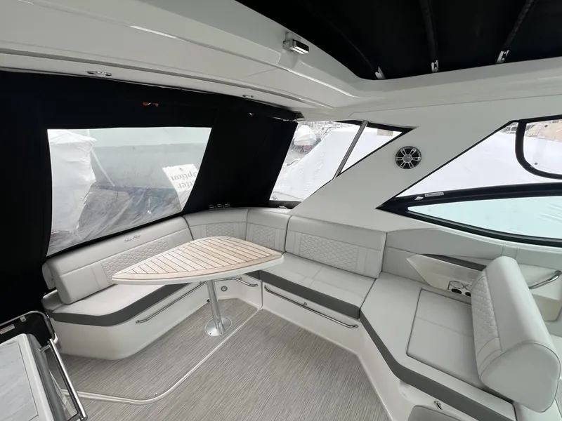 Slide: The Image of 2023 Sea Ray Sundancer 320 interior with sleek seating and modern design. - 15