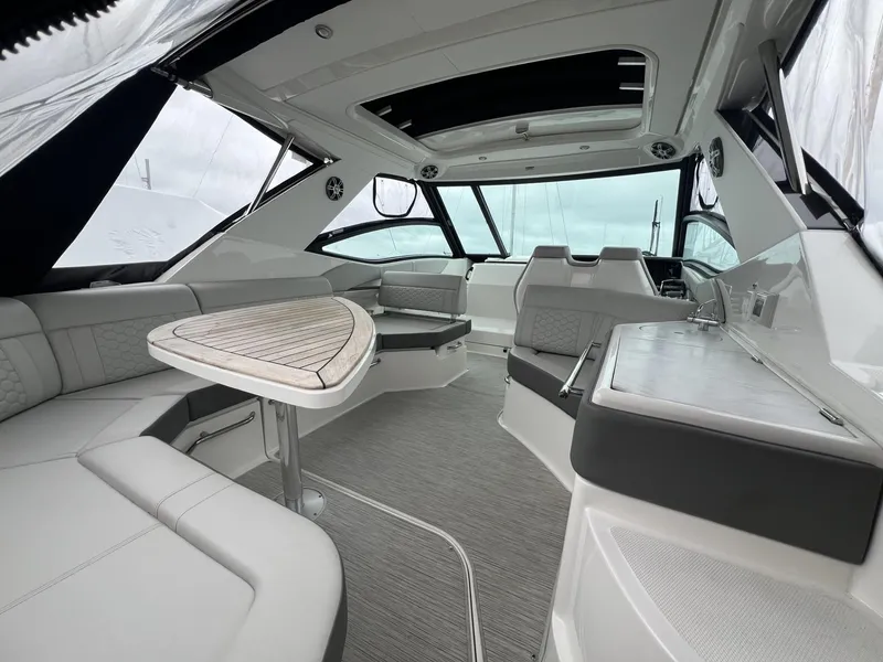 Slide: The Image of 2023 Sea Ray Sundancer 320 interior with sleek seating and modern design. - 17