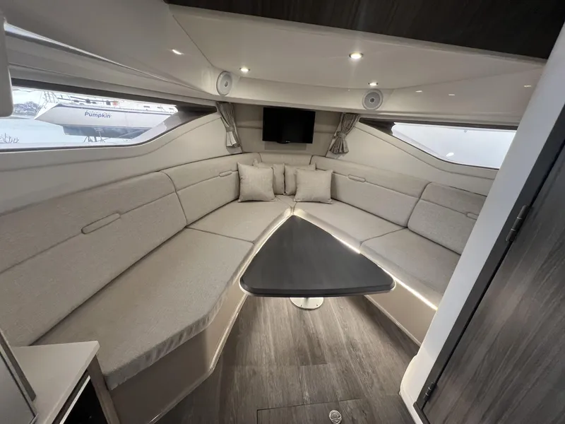 Slide: The Image of 2023 Sea Ray Sundancer 320 interior with elegant seating and modern design. - 24