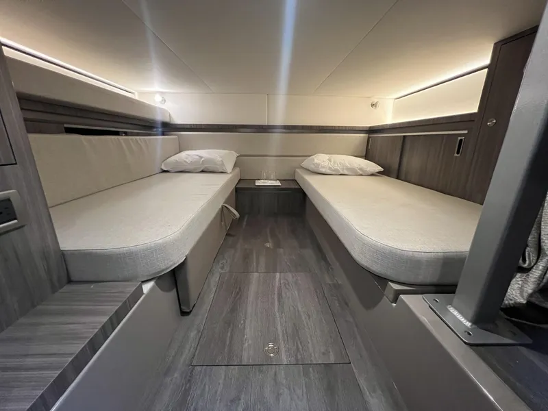 Slide: The Image of 2023 Sea Ray Sundancer 320 cabin interior with twin beds and modern design. - 26