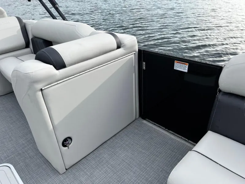 Slide: The Image of 2025 Sylvan Mirage X3 Party Fish boat interior with comfortable seating and water view. - 9