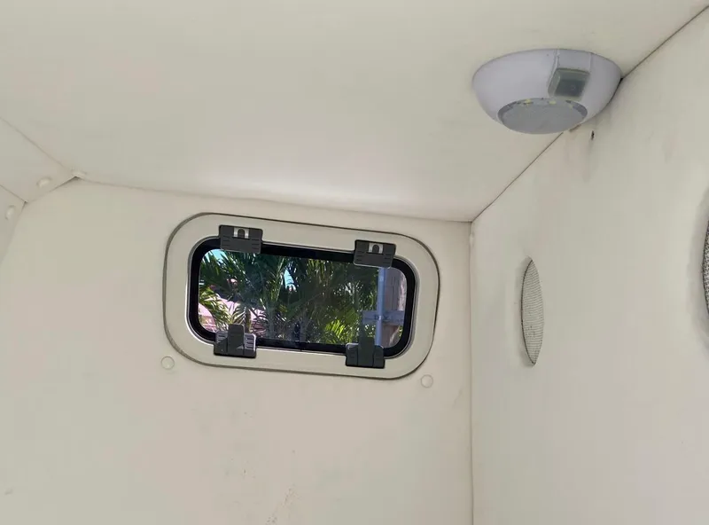 Slide: The Image of Interior of a 2019 Sea Tech 33 boat cabin with window and ceiling light. - 15