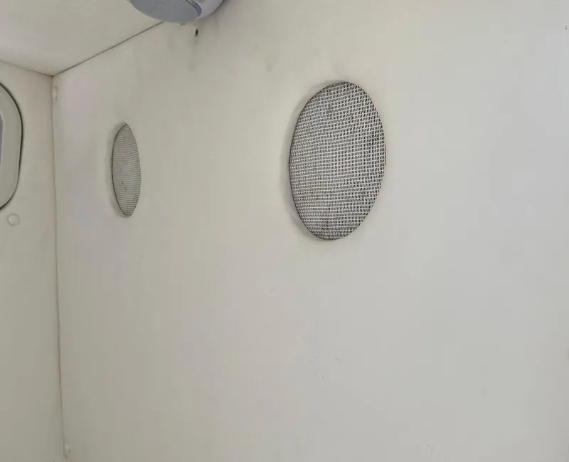 Slide: The Image of Interior of a 2019 Sea Tech 33 boat with circular ventilation grilles. - 16