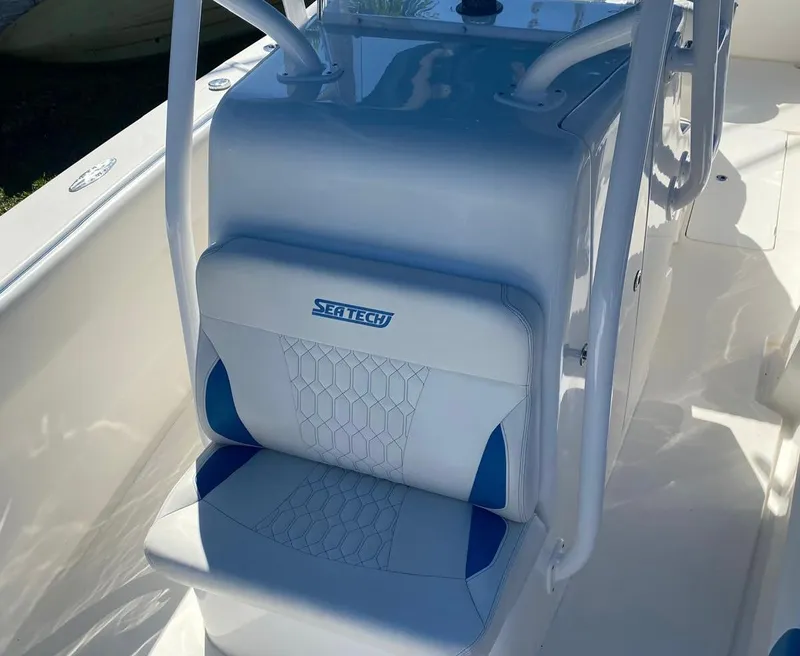 Slide: The Image of 2019 Sea Tech 33 boat seat with blue and white upholstery. - 17
