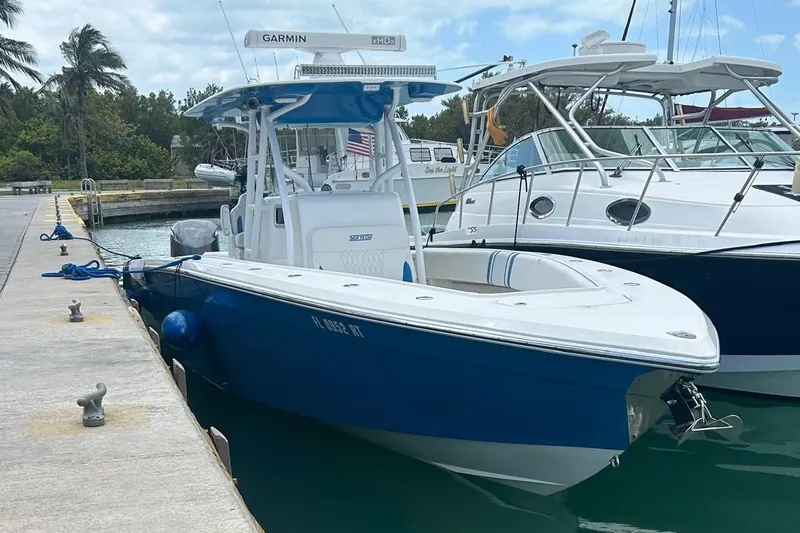 Slide: The Image of Blue 2019 Sea Tech 33 boat docked at marina with Garmin equipment. - 22