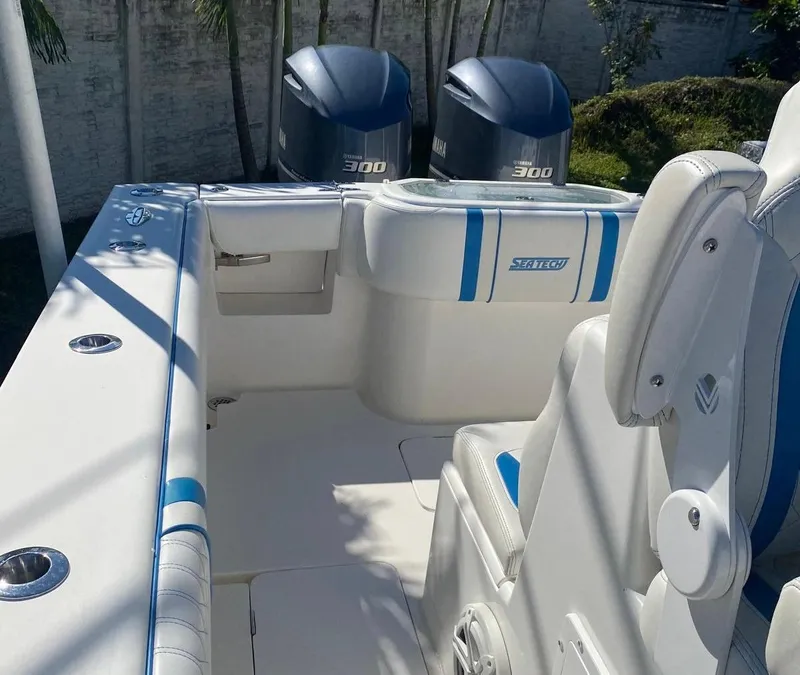 Slide: The Image of 2019 Sea Tech 33 boat interior with dual 300 horsepower engines. - 4