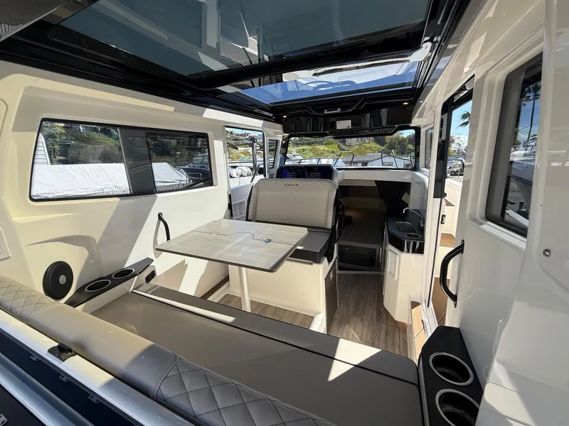 Slide: The Image of Interior of 2025 Navan C30 boat with seating, table, and modern design. - 13