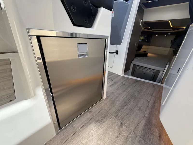 Slide: The Image of Interior of 2025 Navan C30 boat with modern design and wood flooring. - 18