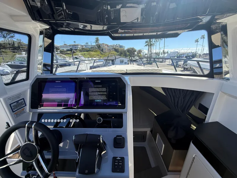 Slide: The Image of Interior view of 2025 Navan C30 boat cockpit with modern controls and dual screens. - 20