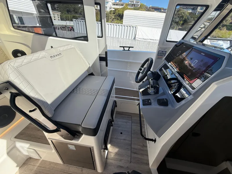 Slide: The Image of Interior of 2025 Navan C30 boat with modern helm and seating. - 21