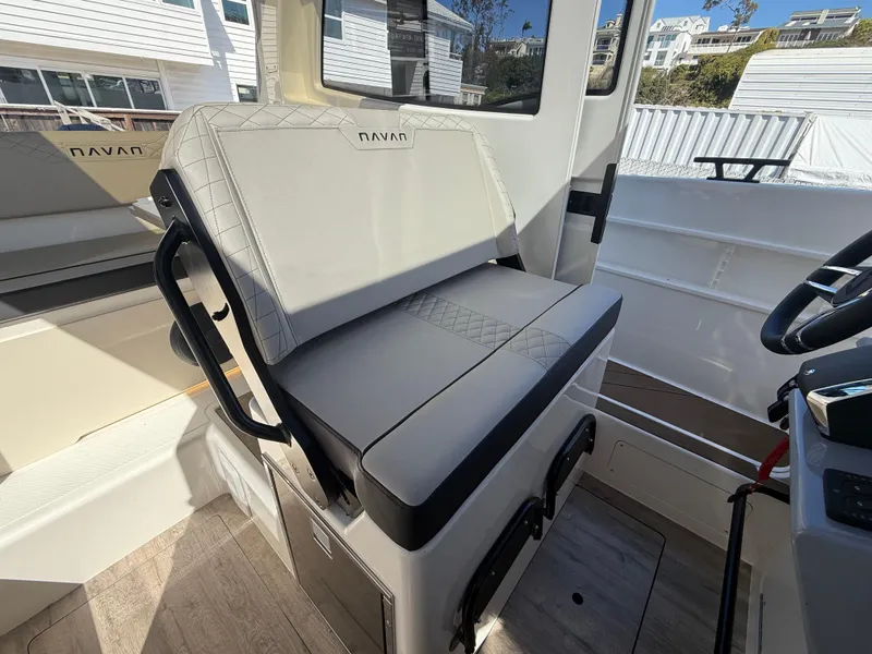 Slide: The Image of Interior of 2025 Navan C30 boat with cushioned seating and modern design. - 22