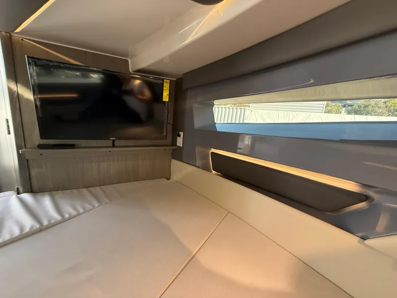 Slide: The Image of Interior of 2025 Navan C30 with TV and modern seating area. - 30