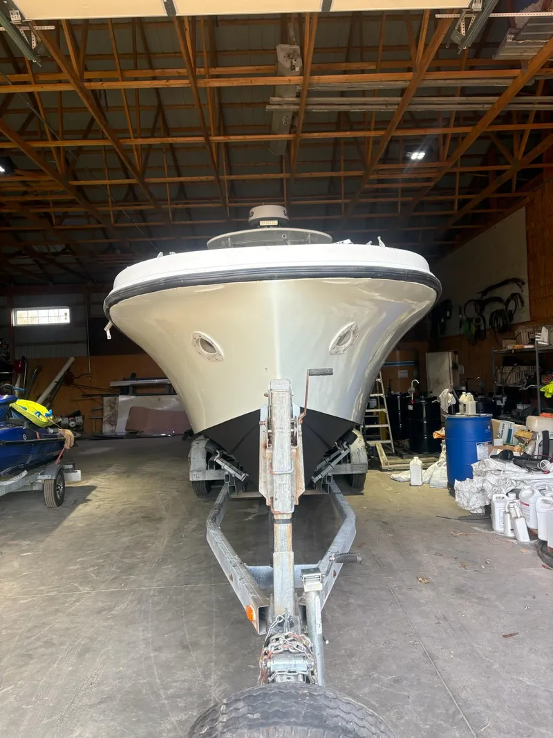 Slide: The Image of 1982 Master Marine 28 Center Console boat on trailer in a storage facility. - 3