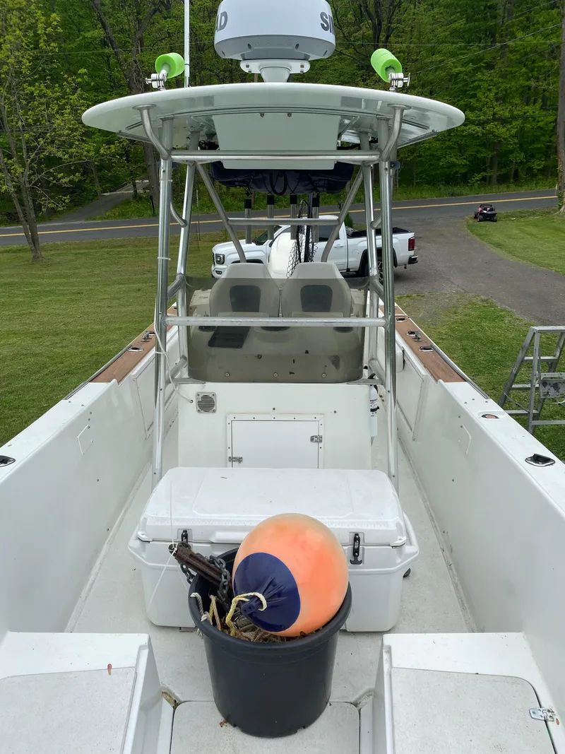 Slide: The Image of 1982 Master Marine 28 Center Console boat with equipment, parked on grass. - 9