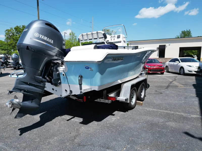 Slide: The Image of 2023 Tidewater 198CC boat with Yamaha engine on trailer in parking lot. - 12