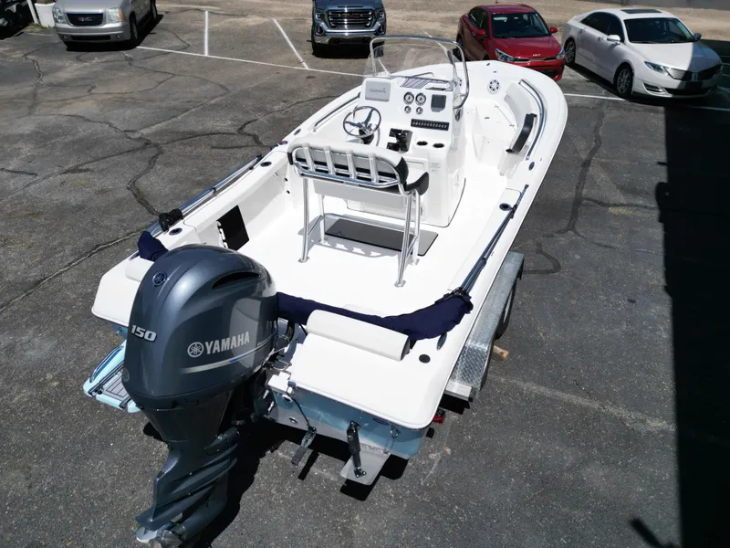 Slide: The Image of 2023 Tidewater 198CC boat with Yamaha 150 engine, parked on a trailer. - 16