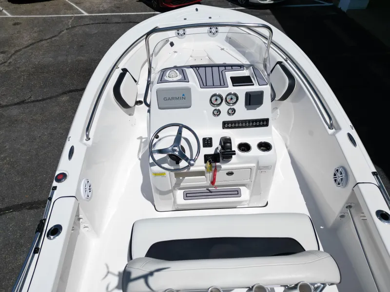 Slide: The Image of 2023 Tidewater 198CC boat interior with Garmin navigation, steering wheel, and control panel. - 18
