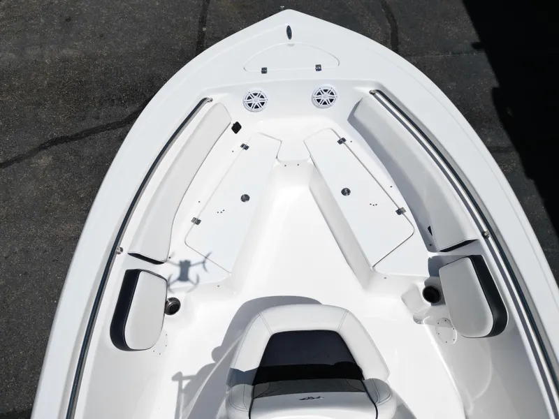 Slide: The Image of 2023 Tidewater 198CC boat interior with white seating and storage compartments. - 20