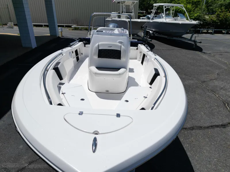Slide: The Image of 2023 Tidewater 198CC boat with sleek design, parked outdoors. - 9