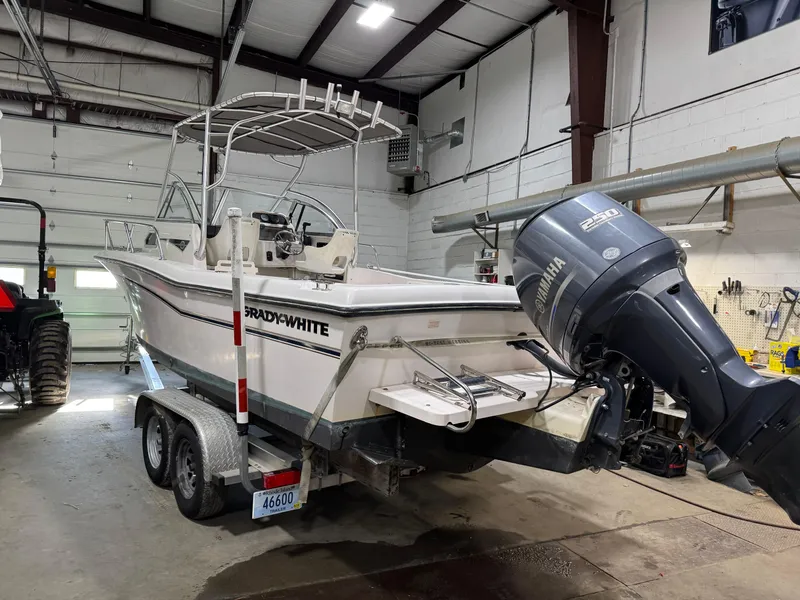Slide: The Image of 2004 Grady-White Seafarer 228 boat on trailer in garage with Yamaha outboard motor. - 1