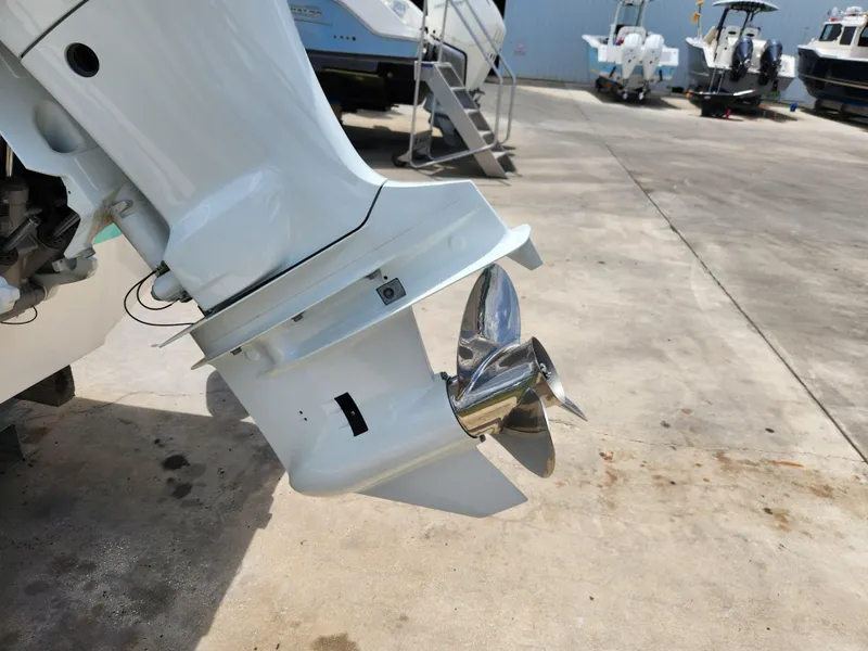 Slide: The Image of Outboard motor of a 2004 Wellcraft 200 LT Fisherman boat with shiny propeller. - 15
