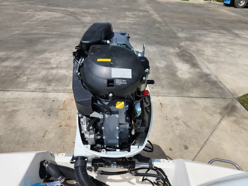 Slide: The Image of 2004 Wellcraft 200 LT Fisherman boat engine on concrete surface. - 17