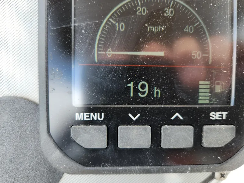 Slide: The Image of Dashboard display of a 2004 Wellcraft 200 LT Fisherman showing 19 hours. - 21