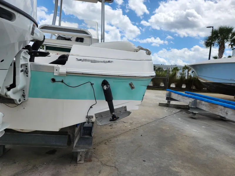 Slide: The Image of 2004 Wellcraft 200 LT Fisherman boat on a trailer, under a partly cloudy sky. - 7
