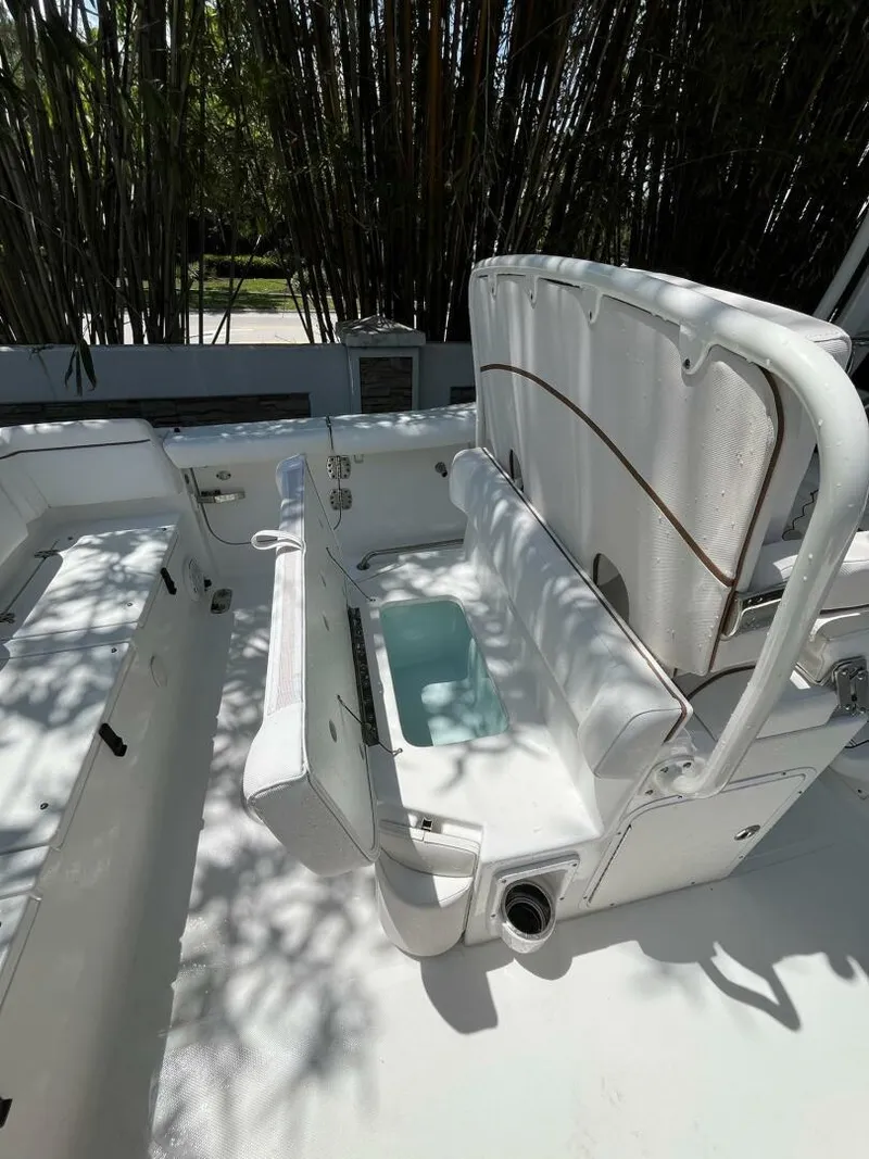 Slide: The Image of 2018 Sea Hunt 255 SE boat interior with seating and storage compartments. - 28
