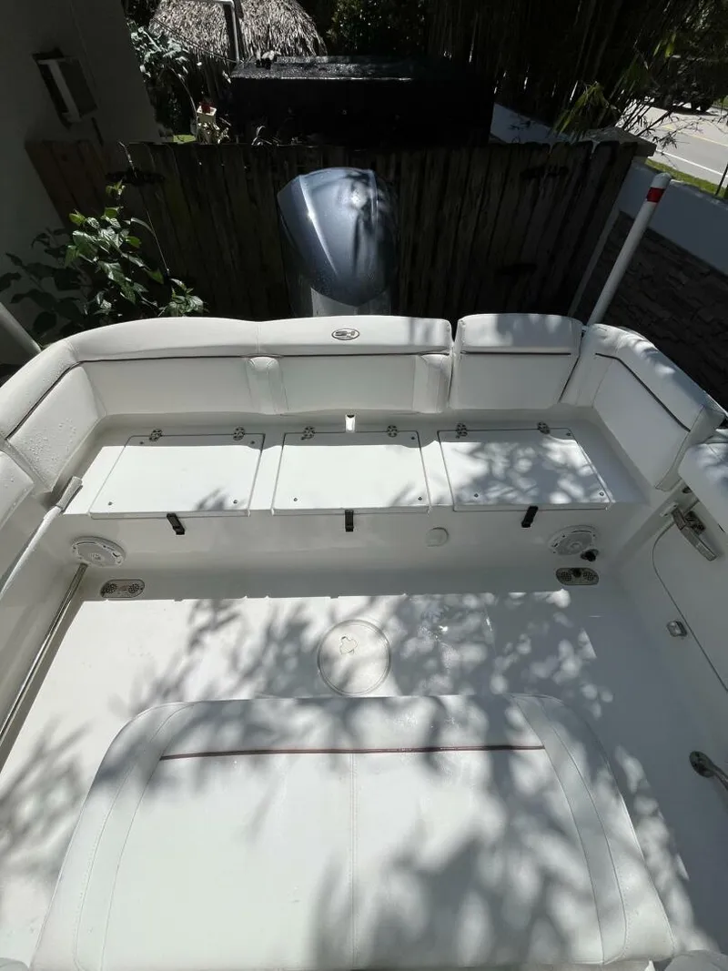 Slide: The Image of 2018 Sea Hunt 255 SE boat interior with seating and storage compartments. - 31