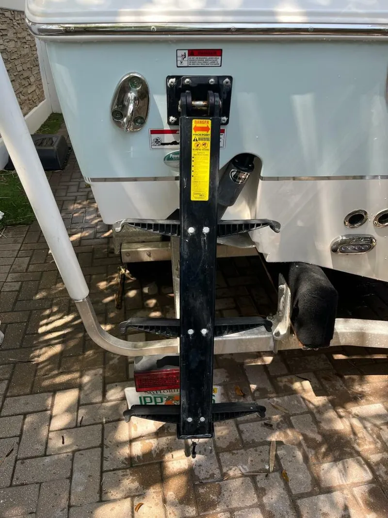 Slide: The Image of 2018 Sea Hunt 255 SE boat trailer hitch on paved surface. - 35