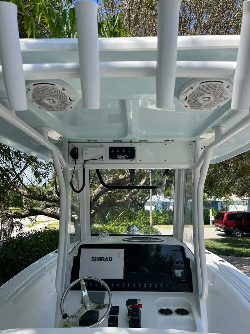 Slide: The Image of 2018 Sea Hunt 255 SE boat console with Simrad display and rod holders. - 8