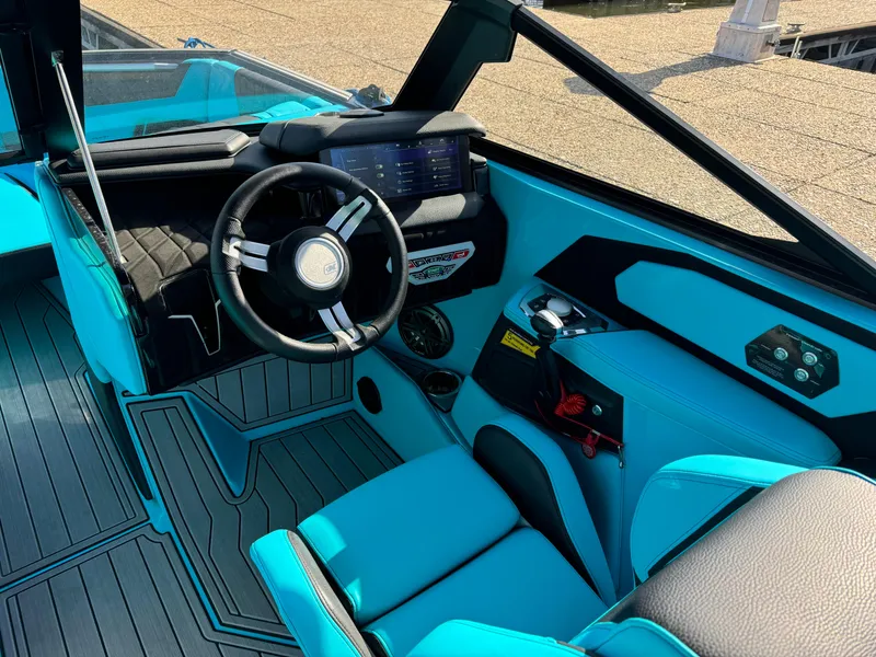 Slide: The Image of 2023 Nautique Super Air Nautique S25 interior with modern dashboard and steering wheel. - 12