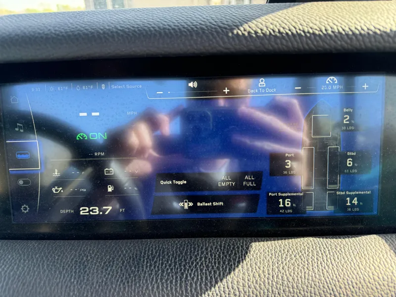 Slide: The Image of Touchscreen display of a 2023 Nautique Super Air Nautique S25 boat showing various controls and settings. - 13