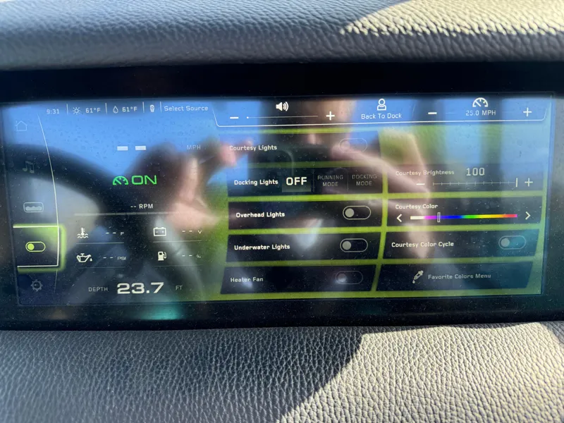 Slide: The Image of 2023 Nautique Super Air Nautique S25 dashboard display with lighting and system controls. - 14