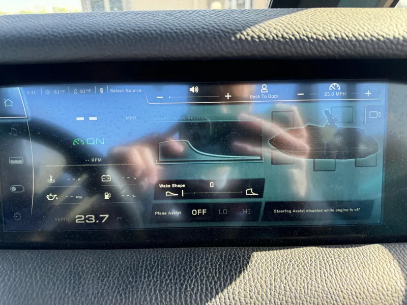 Slide: The Image of 2023 Nautique Super Air Nautique S25 dashboard display showing wake settings and controls. - 18