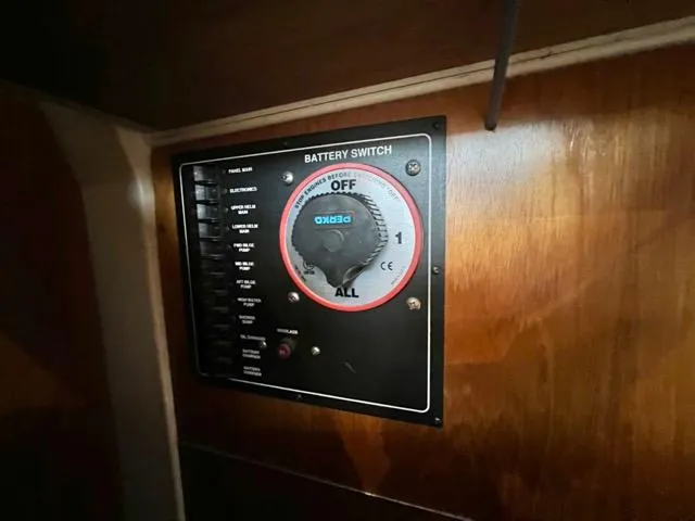 Slide: The Image of Battery switch panel on 2002 Mainship 390 Trawler, featuring multiple settings and controls. - 23