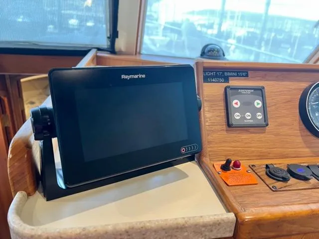 Slide: The Image of Control panel of a 2002 Mainship 390 Trawler with Raymarine display. - 27