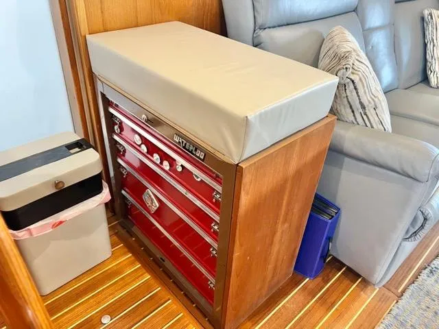 Slide: The Image of Red tool chest with cushioned top in 2002 Mainship 390 Trawler interior. - 30