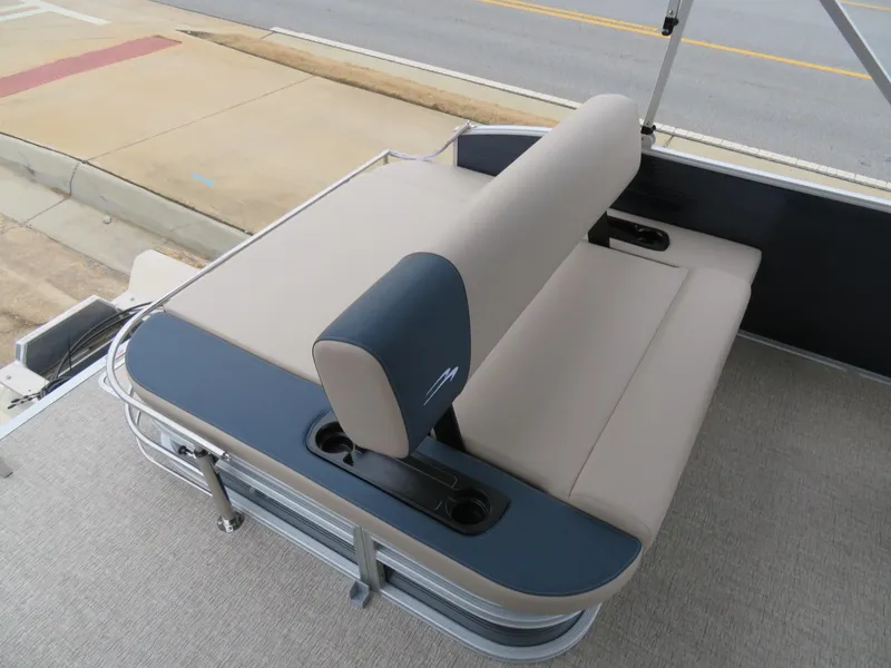 Slide: The Image of 2025 Bennington 22SSB boat seating area with beige upholstery and cup holders. - 16