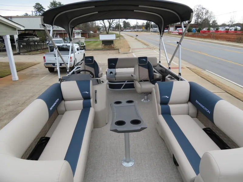 Slide: The Image of 2025 Bennington 22SSB pontoon boat with spacious seating and modern design. - 20