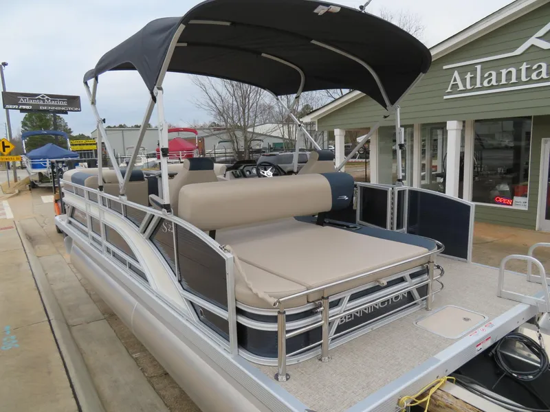 Slide: The Image of 2025 Bennington 22SSB pontoon boat with canopy at Atlanta Marine dealership. - 21