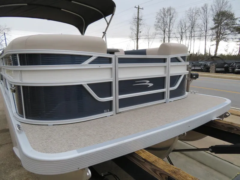 Slide: The Image of 2025 Bennington 22SSB pontoon boat with sleek design and spacious deck. - 4