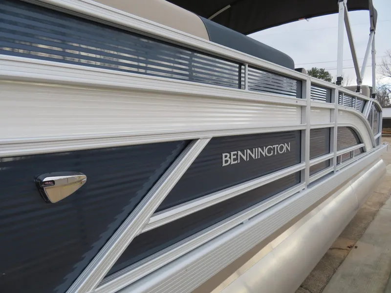 Slide: The Image of 2025 Bennington 22SSB pontoon boat with sleek design and modern features. - 5