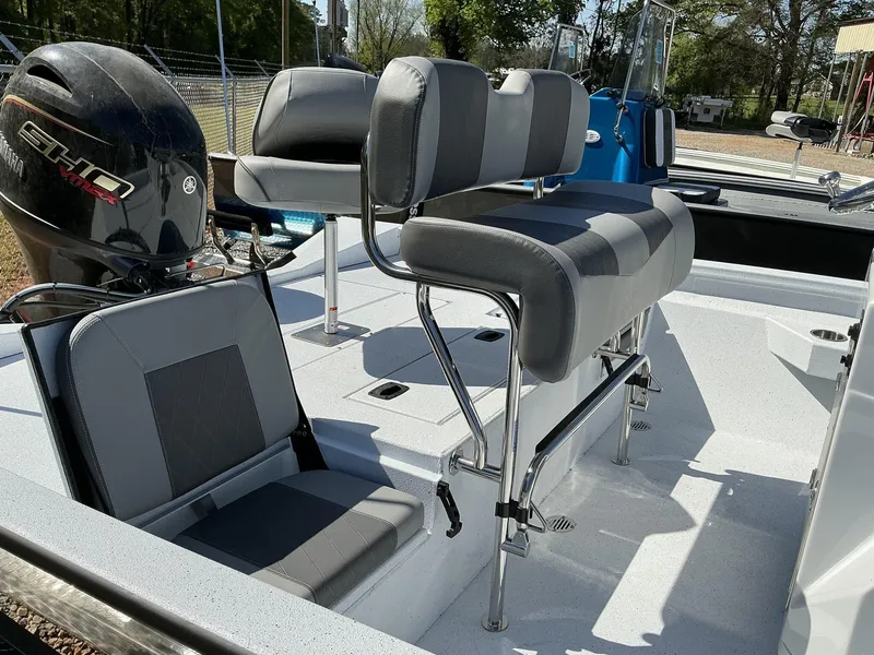 Slide: The Image of 2025 Xpress Hyper-Lift Series H20B boat interior with Yamaha engine and seating. - 9