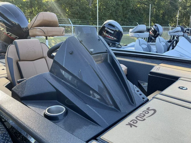 Slide: The Image of 2025 Xpress Hyper-Lift Series H20 BASS boat interior with Yamaha engine, featuring sleek design. - 3