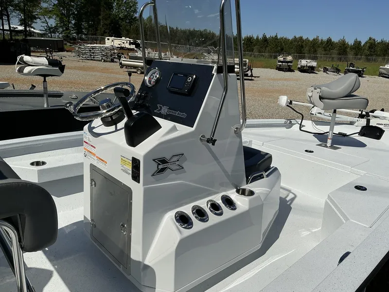 Slide: The Image of 2025 Xpress Hyper-Lift Series H20B boat console with steering wheel and seating. - 7
