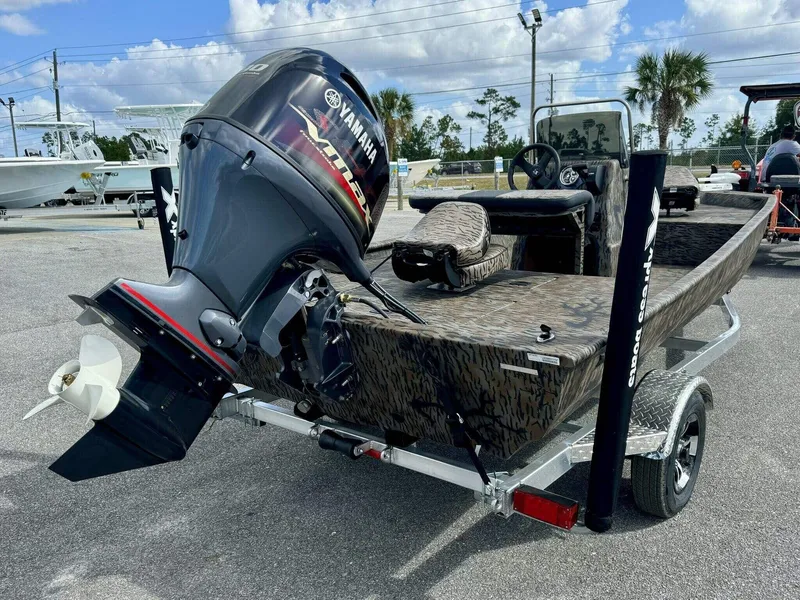 Slide: The Image of 2025 Xpress Xplorer Series XP18CC boat with Yamaha outboard motor on trailer. - 3