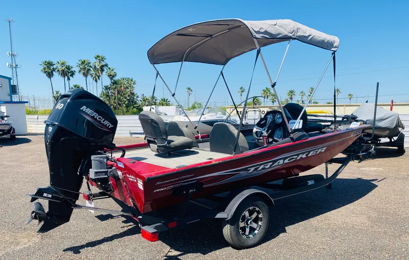 Slide: The Image of 2021 Tracker Pro Team 175 TXW Tournament Edition boat with canopy and Mercury engine. - 5