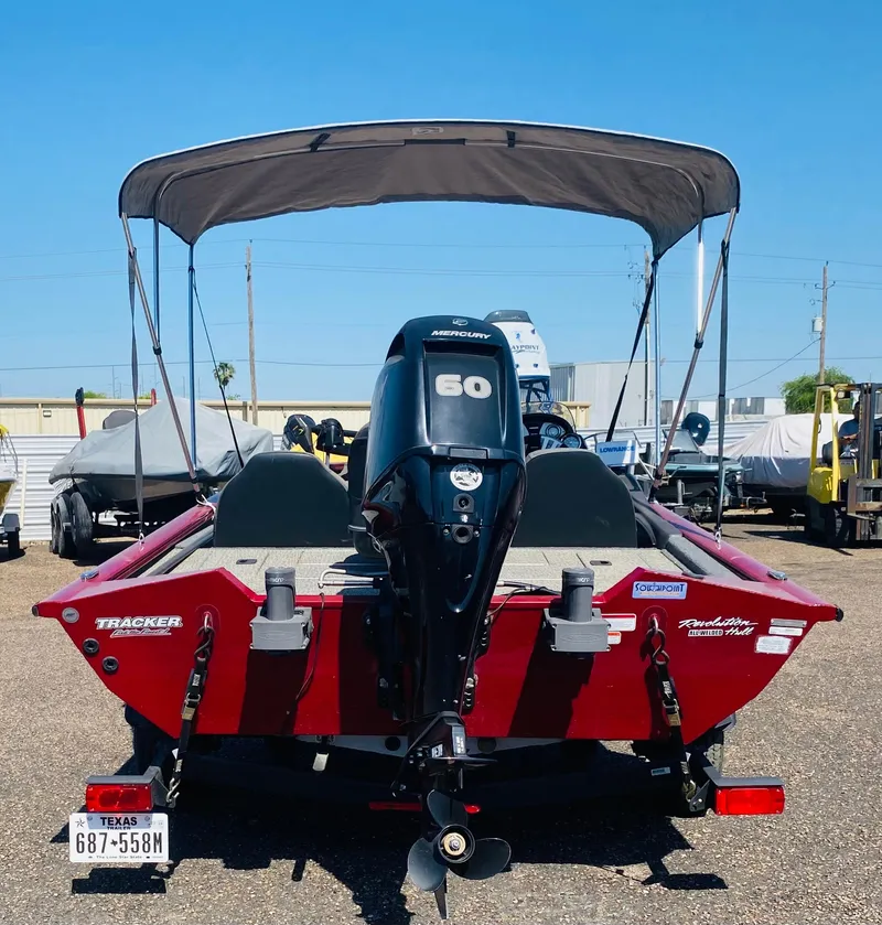 Slide: The Image of 2021 Tracker Pro Team 175 TXW Tournament Edition boat with canopy and outboard motor. - 7